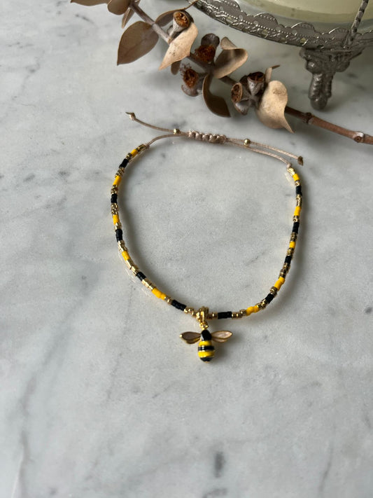 Pulsera cristales amarillos y negro con detalles en baño de oro de 24k, con abeja baño de oro, ajustable de 15cm a 20cm