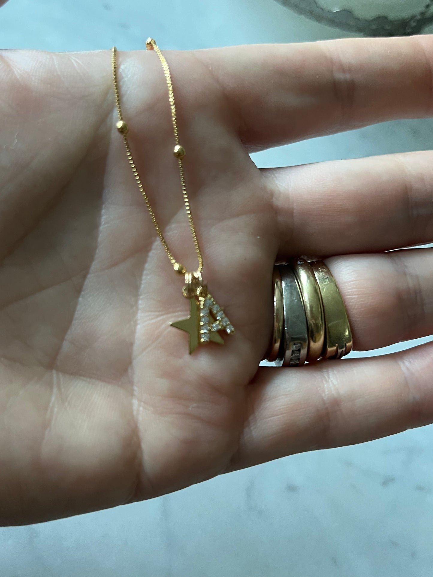 Cadena 49cm estrella y letra A