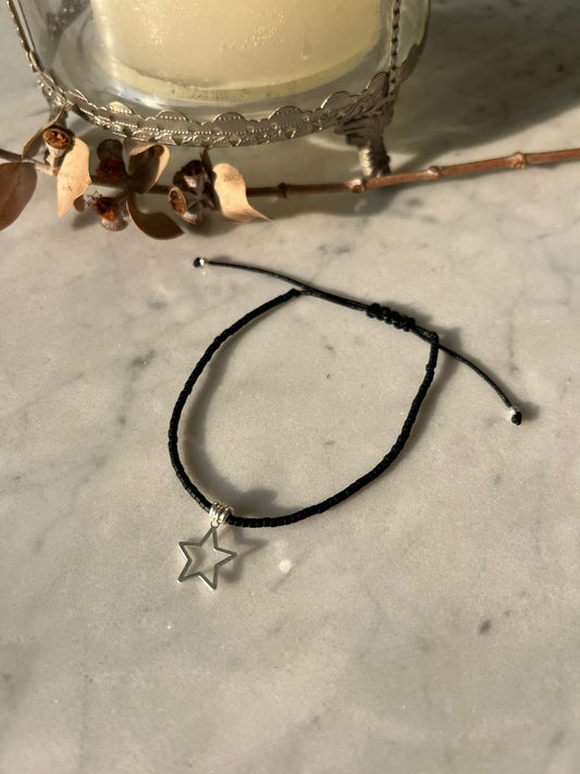 Pulsera hilo negro, cristales negros y estrella de plata