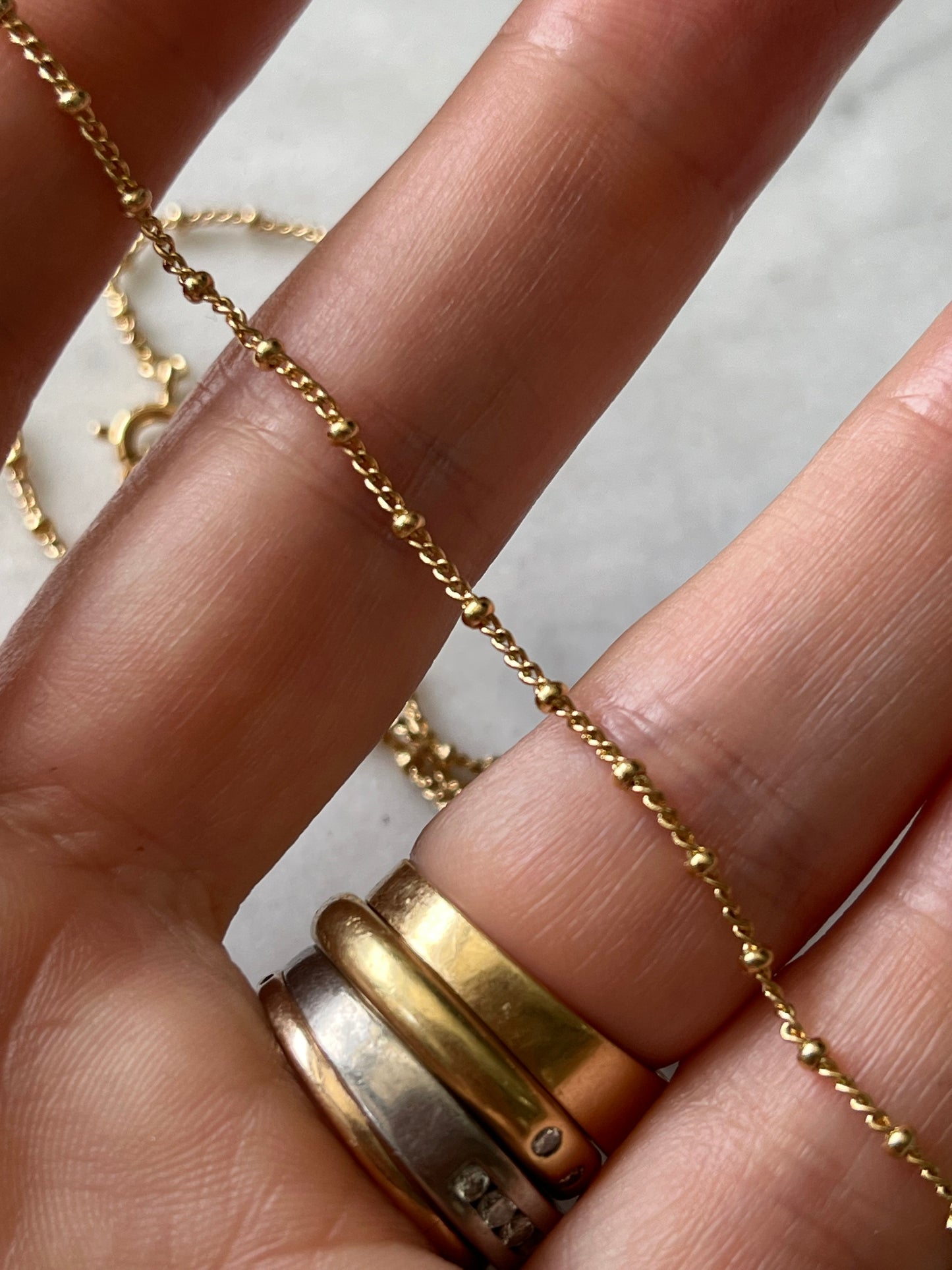 Cadena Grumet mini bolita 45cm baño de oro