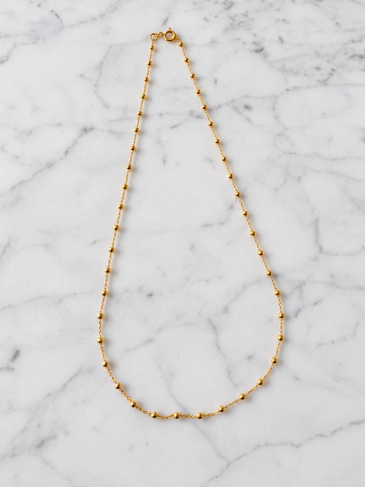 Cadena limada bolita baño de oro 24k puesta – Ana Diseño